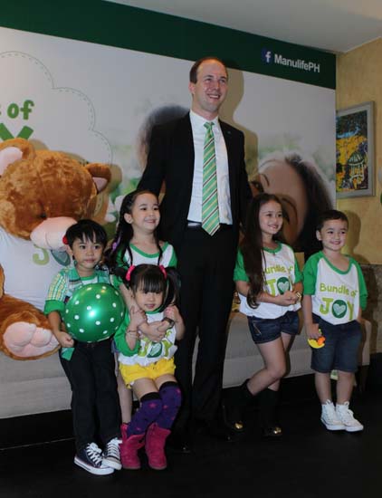 Ryan Charland President & CEO Manulife Philippines with kids during the launch of Bundle of Joy Advocacy